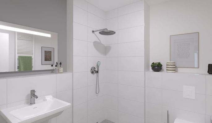 Ein modern gefliestes Badezimmer mit bodengleicher