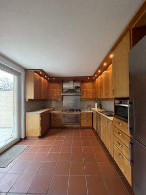 Küche mit Zugang zum Garten