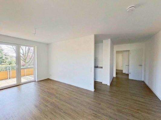 Ansicht I: Wohn- und Esszimmer mit offenem Küchenbereich