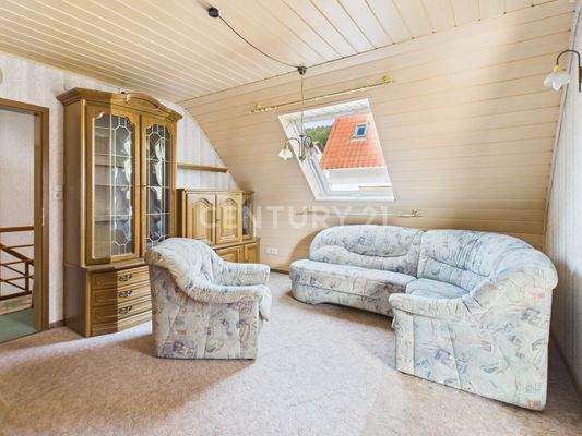 Wohnzimmer mit Balkonzugang Obergeschoß