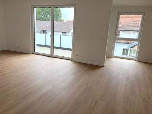 Wohnzimmer mit Zugang zur Terrasse