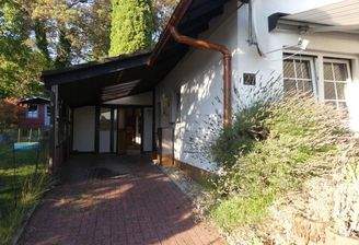 Ansicht West mit Carport und Garagen-Werkstattanbau