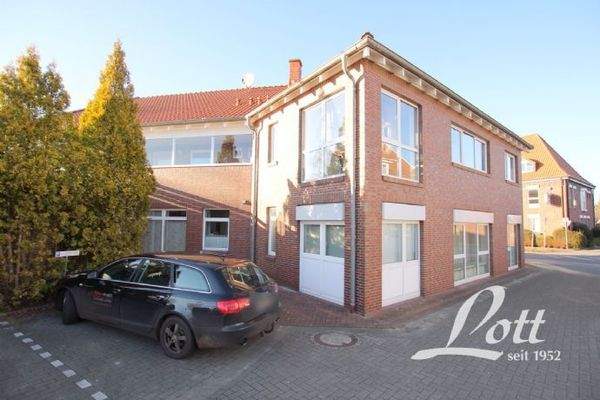 2) Wohn- und Geschäftshaus