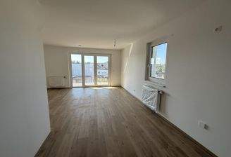 Haus_1_Top_12_Küche_mit_Blick_auf_Wohnbereich