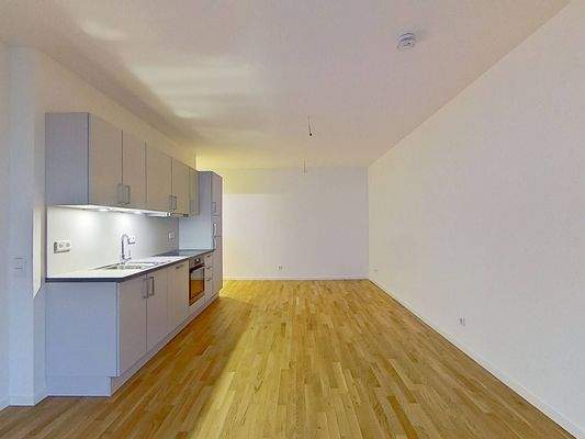 Ansicht III: Wohn- und Schlafzimmer mit Küche