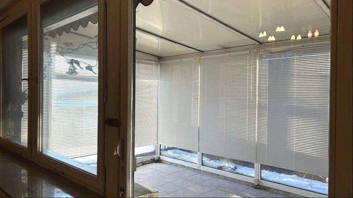 Terrasse mit Wintergarten