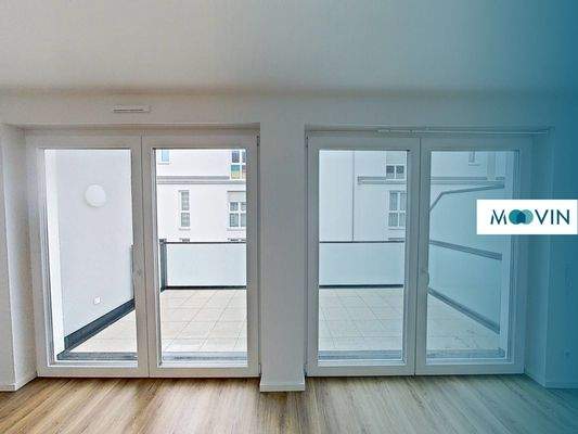 Ansicht I: Wohnzimmer mit offener Küche