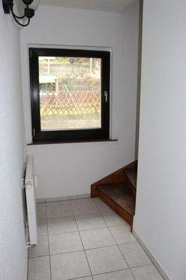 Wohnungsflur mit Aufgang zur oberen Etage