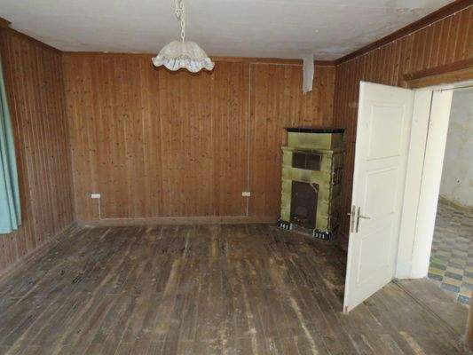 Wohnzimmer mit Kachelofen 