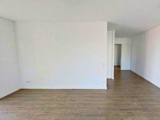 Ansicht III: Wohn- und Esszimmer mit offenem Küchenbereich