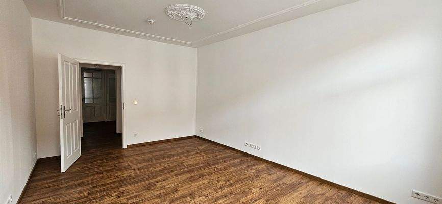 Spacious Room with Wooden Floor