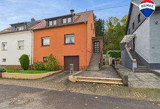 RE/MAX Immobilien DeLux Einfamilienhaus Körprich Außenansicht