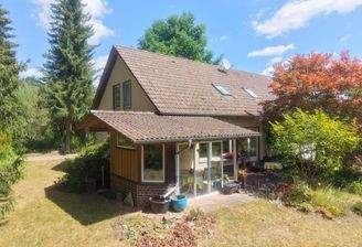 Gebäudeansicht Süd-West mit wintergartenartig überbauter Terrasse