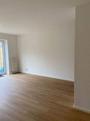 Wohnzimmer_mit Ecke zur EBK.jpeg