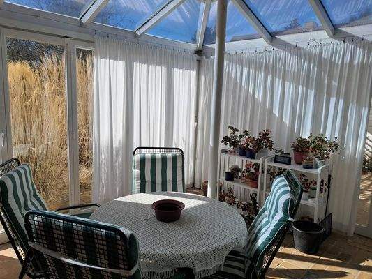 Wintergarten mit Kamin