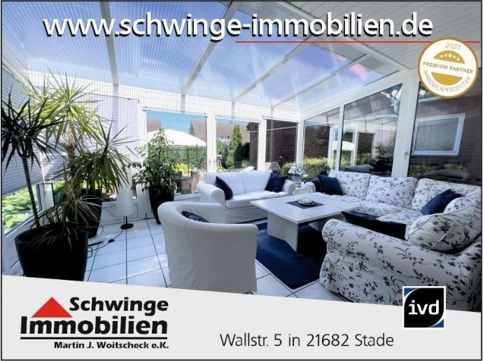 SCHWINGE IMMOBILIEN Stade: Zweifamilienhaus mit Wintergarten und 3 Garagen in Wischhafen.