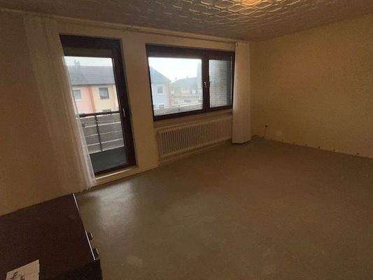 Schlafzimmer im Obergeschoß mit Balkon