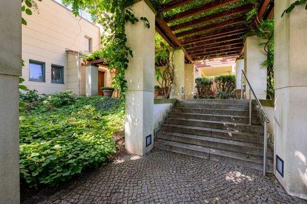 Representative portal with pergola roofing