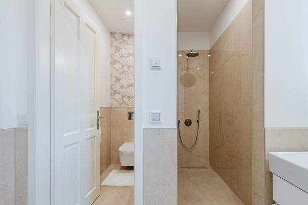 Bathroom with separate toilet and spacious shower