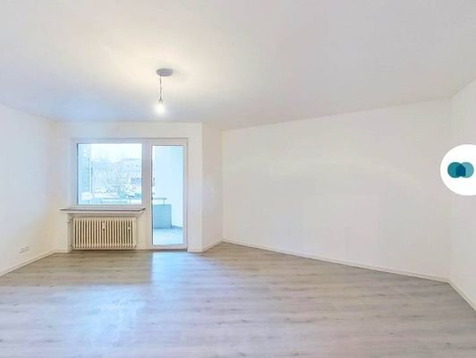 Ansicht I: Wohnzimmer mit Zugang zum Balkon