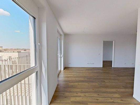 Ansicht VI: Wohn- und Esszimmer mit offenem Küchenbereich