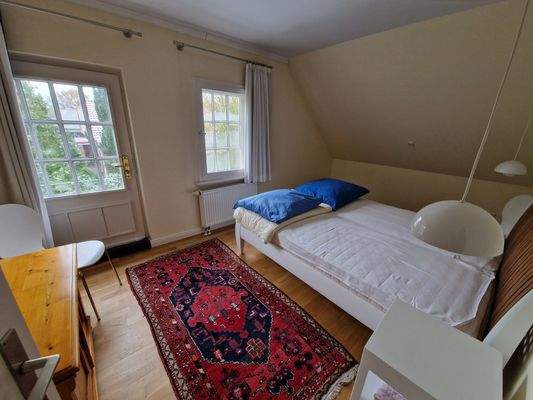Schlafzimmer mit Dachterrassenzugang