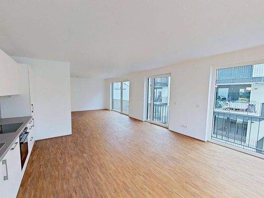 Ansicht V: Wohn- und Esszimmer mit offenem Küchenbereich