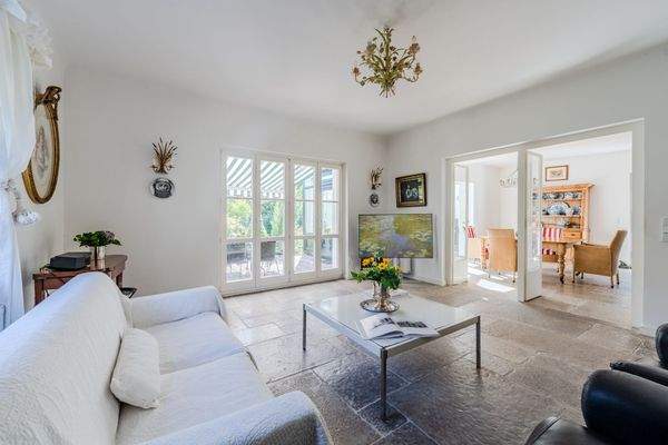 Light-flooded living room with terrace access