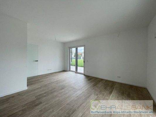 Wohnzimmer mit offener Küche