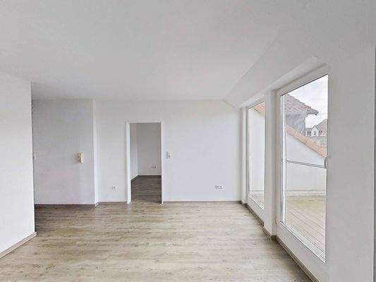 Ansicht III: Wohn- und Esszimmer mit offenem Küchenbereich