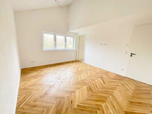 Schlafzimmer 1 mit Zugang zum Bad en Suite