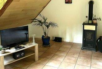 Wohnzimmer mit Ofen OG