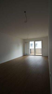 Wohnzimmer mit Balkon 