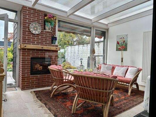 Wintergarten mit Kamin