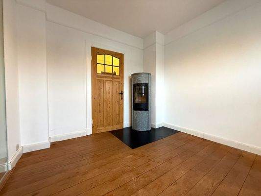 Kamin, Parkett und hohe Decken