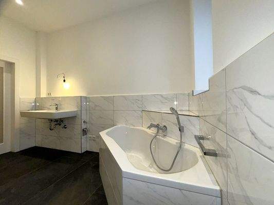 Bathroom with shower and bathtub