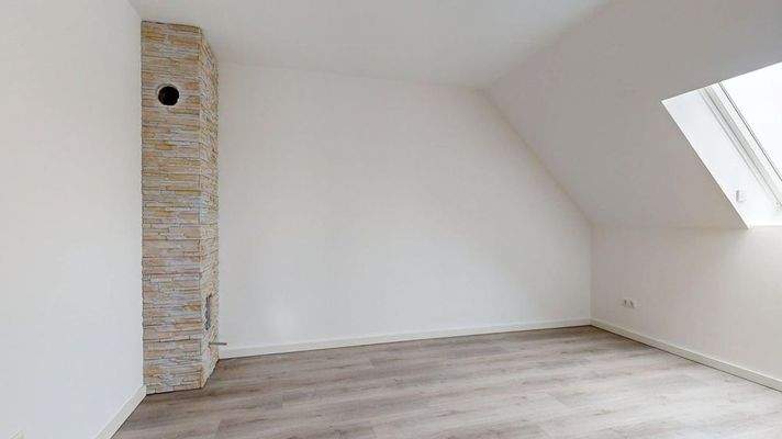 Schlafzimmer mit Kamin