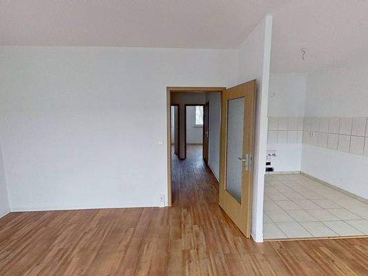 Ansicht V: Wohn- und Esszimmer mit offenem Küchenbereich