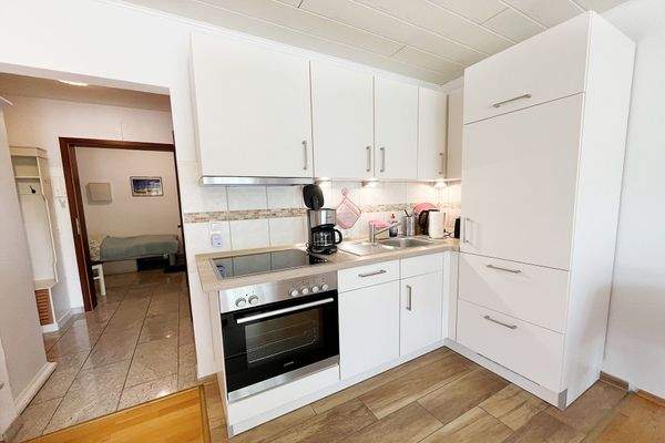 ...mit direktem Durchgang zum Eingang