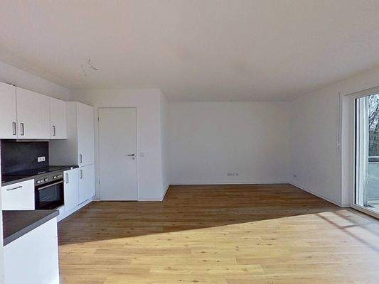 Ansicht II: Wohn- und Esszimmer mit offenem Küchenbereich