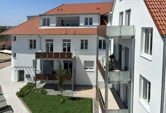 Blick vom Penthouse auf den Bestandsbau