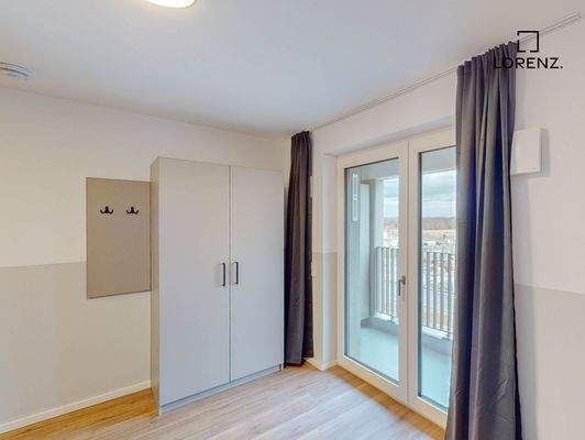 Wohnbereich mit Zugang zum Balkon