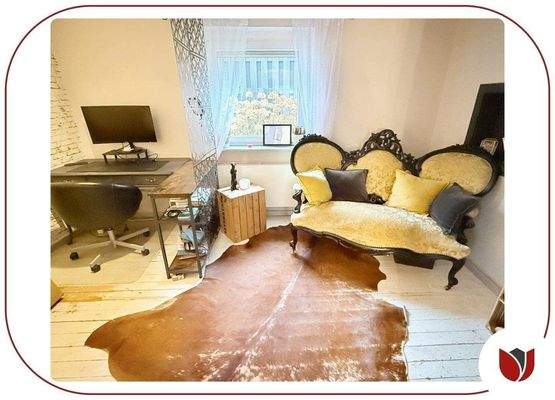 Weiteres Zimmer am Wohn-/Essbereich mit Kamin