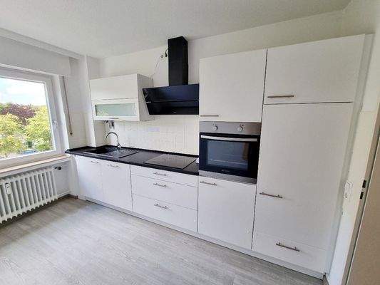 ...mit eingebauter Küchenzeile