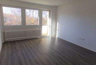 Wohnzimmer mit Balkon