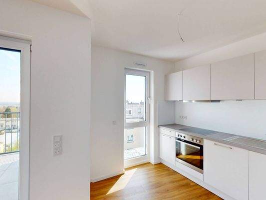 Ansicht II: Wohn- und Essbereich mit Einbauküche