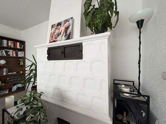 EG Wohnzimmer: Der Kachelofen spendet Wärme und gemütliche Atmosphäre