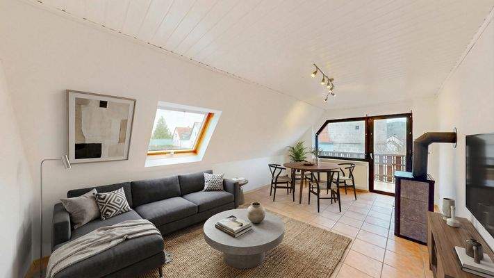 Einrichtungsbeispiel Wohnzimmer mit Kaminofen und Zugang zum Süd Westbalkon