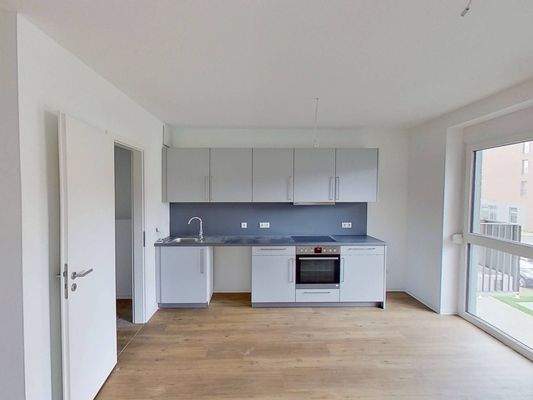 Ansicht II: Wohn- und Esszimmer mit offenem Küchenbereich