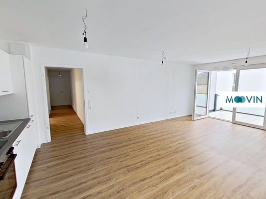 Ansicht III: Wohnzimmer mit offenem Küchenbereich